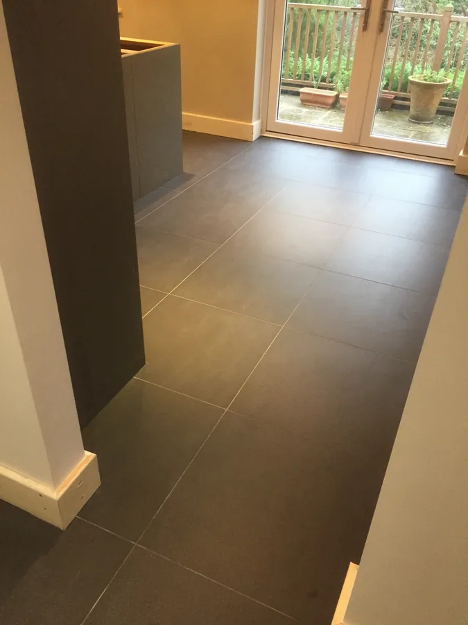 Large-format floor tiling through to garden doors